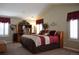 Spacious main bedroom featuring vaulted ceilings, shuttered windows, and a cozy sitting area with plenty of sunlight at 2819 Canyon Crest Dr, Highlands Ranch, CO 80126