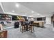 Basement with poker table, multiple wall-mounted TVs, and comfortable sofa seating at 16123 Quarry Hill Dr, Parker, CO 80134