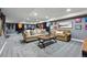 Finished basement with stylish sofas, large coffee table, and sports-themed wall decor at 16123 Quarry Hill Dr, Parker, CO 80134