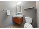 Modern half-bathroom featuring a floating vanity, updated fixtures, and contemporary design at 16123 Quarry Hill Dr, Parker, CO 80134