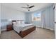 Bright bedroom features a ceiling fan, carpet floors, and a window providing natural light at 16123 Quarry Hill Dr, Parker, CO 80134