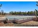 Community pool area with fencing, sun loungers, and an abundance of trees at 16123 Quarry Hill Dr, Parker, CO 80134