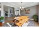 Dining room featuring hardwood floors and a large wood table at 16123 Quarry Hill Dr, Parker, CO 80134