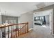Hallway with carpet flooring, showing views into a dining room and main bedroom at 16123 Quarry Hill Dr, Parker, CO 80134