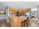 Cozy kitchen with an island, granite countertops, stainless steel appliances, and wooden cabinets at 16123 Quarry Hill Dr, Parker, CO 80134