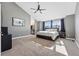 Main bedroom with vaulted ceilings, carpet floors, natural light and gray paint at 16123 Quarry Hill Dr, Parker, CO 80134