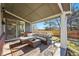 Relaxing covered patio area with comfortable outdoor seating, creating an inviting space at 16123 Quarry Hill Dr, Parker, CO 80134