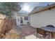 Cozy backyard featuring a brick patio and a small shed with a garden at 8300 S Upham Way, Littleton, CO 80128