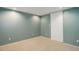 Basement bedroom with neutral carpet, overhead lighting, and closet at 8300 S Upham Way, Littleton, CO 80128
