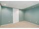 Basement bedroom with neutral carpet, drop ceiling, and closet at 8300 S Upham Way, Littleton, CO 80128