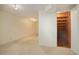Large finished basement with carpet flooring, recessed lighting, and stairway access at 8300 S Upham Way, Littleton, CO 80128