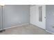 Neutral bedroom with carpet flooring, sliding door closet, and ample outlets at 8300 S Upham Way, Littleton, CO 80128