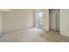 Bedroom with carpet, sliding glass doors to patio, and closet with storage at 8300 S Upham Way, Littleton, CO 80128