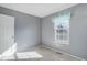 Clean bedroom with neutral carpet, window and closet, perfect for relaxation at 8300 S Upham Way, Littleton, CO 80128