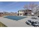 Community pool is covered for the winter with picnic tables nearby and a building at the end of the pool at 8300 S Upham Way, Littleton, CO 80128