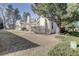 Charming townhouse with well-maintained landscaping and mature trees at 8300 S Upham Way, Littleton, CO 80128