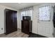 View of kitchen, showing an exterior door and cabinet with microwave at 8300 S Upham Way, Littleton, CO 80128