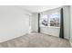 A bright bedroom with carpet, a closet and arched windows at 9055 Holland St, Broomfield, CO 80021