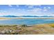 Breathtaking mountain and lake views enhance this property's appeal at 9055 Holland St, Broomfield, CO 80021