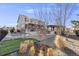 Spacious backyard with a well-manicured lawn, pergola with BBQ, and a serene outdoor setting at 7899 S Country Club Pkwy, Aurora, CO 80016