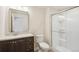 Functional bathroom featuring a walk-in shower, modern vanity, and updated fixtures at 7899 S Country Club Pkwy, Aurora, CO 80016