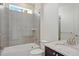 Well-lit bathroom showcasing a vanity with granite countertops, tiled shower/tub, and chrome fixtures at 7899 S Country Club Pkwy, Aurora, CO 80016