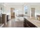 Bright bathroom featuring a soaking tub, granite counters, and access to a walk-in closet at 7899 S Country Club Pkwy, Aurora, CO 80016