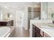 Open bathroom layout showcasing double vanity with granite countertop and walk-in glass shower at 7899 S Country Club Pkwy, Aurora, CO 80016