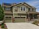 Exterior elevation of a two story house with a two car garage at 7899 S Country Club Pkwy, Aurora, CO 80016