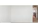 Hallway leading to bedrooms and features neutral carpet and white walls at 7899 S Country Club Pkwy, Aurora, CO 80016