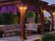 Cozy outdoor space with a wooden pergola, comfortable seating, and decorative lighting for a relaxing evening ambiance at 7899 S Country Club Pkwy, Aurora, CO 80016