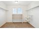 Spacious walk-in closet featuring adjustable shelving, carpeted floors, and natural light at 7899 S Country Club Pkwy, Aurora, CO 80016