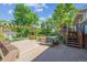 Multi-level wooden backyard deck with benches and an outdoor grill at 848 S 13Th Ave, Brighton, CO 80601