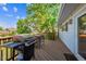 Wooden deck featuring multiple grills and ample space for outdoor gatherings at 848 S 13Th Ave, Brighton, CO 80601