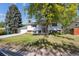 Charming two-story home with a well-manicured lawn and mature trees at 848 S 13Th Ave, Brighton, CO 80601