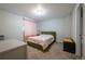 Bright bedroom featuring a colorful bed and carpeted floors at 4673 S Lowell Blvd, Denver, CO 80236