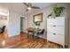 Cozy dining area featuring hardwood floors and stylish decor, perfect for Gathering meals at 4673 S Lowell Blvd, Denver, CO 80236