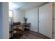 Cozy home office featuring wood laminate flooring and desk with a printer and decor at 4673 S Lowell Blvd, Denver, CO 80236