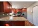 Beautiful kitchen with stainless steel appliances, granite counters, and ample cabinet space at 4673 S Lowell Blvd, Denver, CO 80236