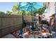 Enclosed patio featuring outdoor dining area with shade umbrella and privacy fence at 4673 S Lowell Blvd, Denver, CO 80236