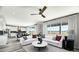 Bright, open concept living area flows into the kitchen and dining space with beautiful outdoor views at 9186 Telluride Ct, Commerce City, CO 80022