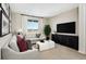 Relaxing space features comfortable seating, a large TV, and a serene atmosphere for leisure and entertainment at 9186 Telluride Ct, Commerce City, CO 80022