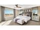 Serene primary bedroom offers scenic views, neutral tones, and stylish accents for a restful escape at 9186 Telluride Ct, Commerce City, CO 80022