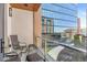 Urban balcony space with comfortable seating and clear glass railings overlooking the city at 1901 Wazee St # 504, Denver, CO 80202