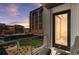 Balcony with outdoor seating offering views of the cityscape and nearby green space at 1901 Wazee St # 504, Denver, CO 80202