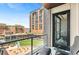 Balcony with patio chairs overlooking a courtyard featuring outdoor dining and seating areas at 1901 Wazee St # 504, Denver, CO 80202