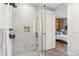 Contemporary bathroom with a frameless shower and entry into the bedroom at 1901 Wazee St # 504, Denver, CO 80202