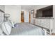 Cozy bedroom features a dresser with decor, a neutral color palette, and doorway leading to other rooms at 1901 Wazee St # 504, Denver, CO 80202