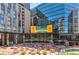 Lively outdoor plaza surrounded by modern buildings and large LED screens at 1901 Wazee St # 504, Denver, CO 80202