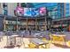 Bustling urban plaza featuring various restaurants and outdoor seating under digital displays at 1901 Wazee St # 504, Denver, CO 80202